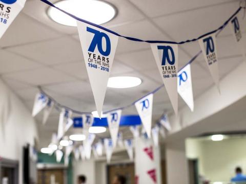 Flags hung up in a hospital waiting room celebrating the 70th anniversary of the NHS