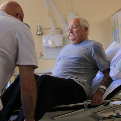 Man being cared for in hospital